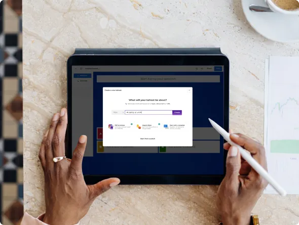 Person using a stylus to create a new Kahoot quiz on a tablet, with the quiz topic setup dialog open on screen