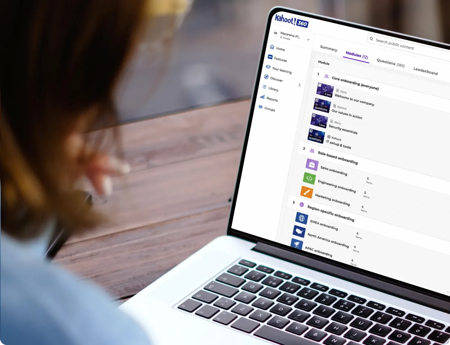 Person viewing a Kahoot 360 course with 12 modules covering core, role-based, and region-specific onboarding