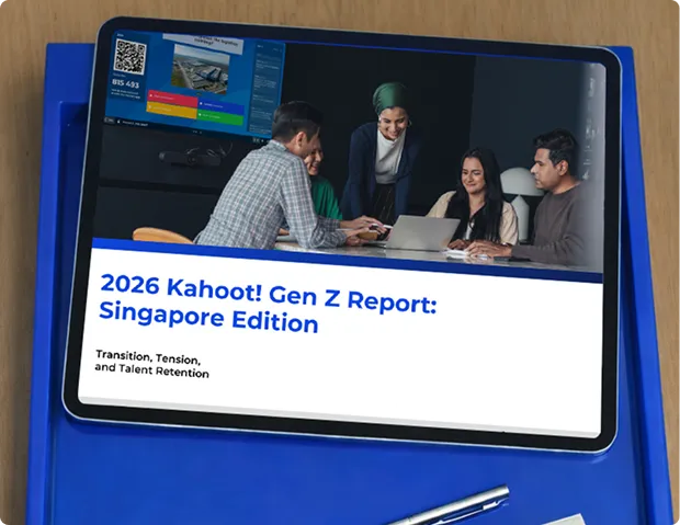 A digital tablet is shown resting on a bright blue tray, displaying the cover page of a business document titled "2026 Kahoot! Gen Z Report: Singapore Edition". Below the main title is the subtitle, "Transition, Tension, and Talent Retention". The top half of the screen features a photograph of a diverse group of four professionals gathered around a laptop in a modern office, while the upper-left corner shows a smaller inset of a Kahoot! quiz interface with a QR code. A silver pen is partially visible on the blue surface at the bottom of the frame.