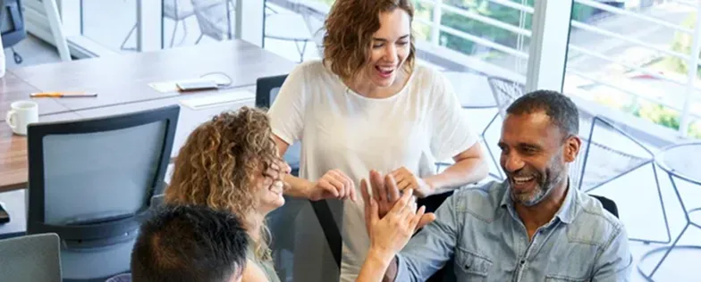 coworkers talking in meeting room